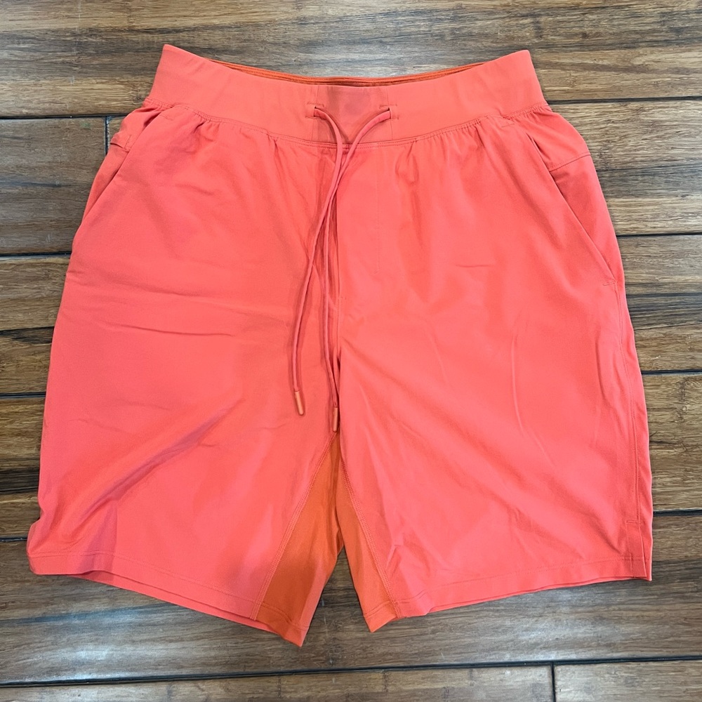 Men’s Med Orange lined Lululemon athletic shorts